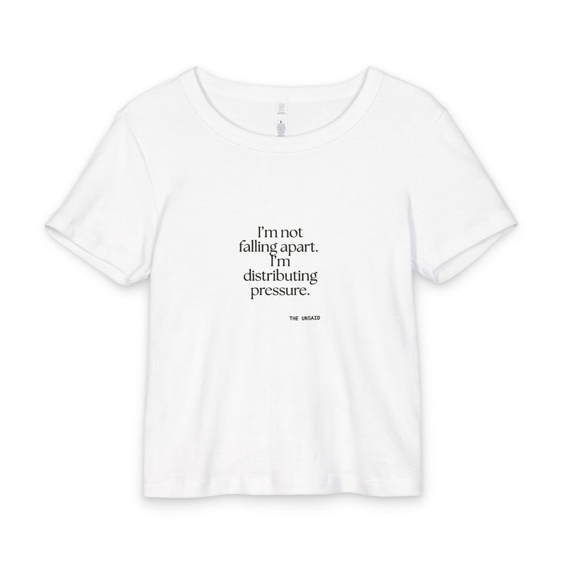 Baby Tee — I’m not falling apart. I’m distributing pressure.